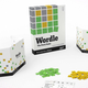 The Wordle board game sitting on a white table.